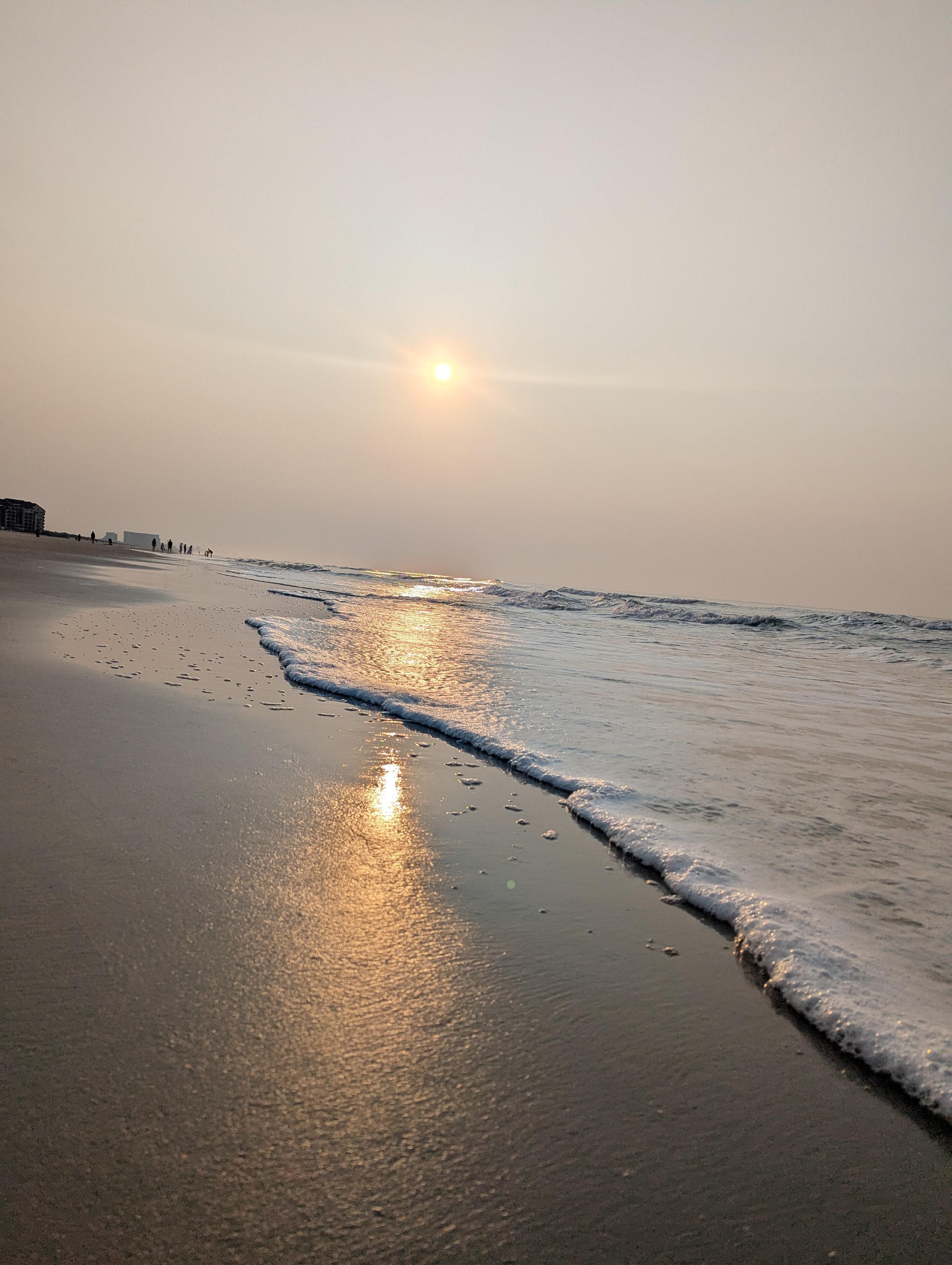 Sunrise to the left of the resort