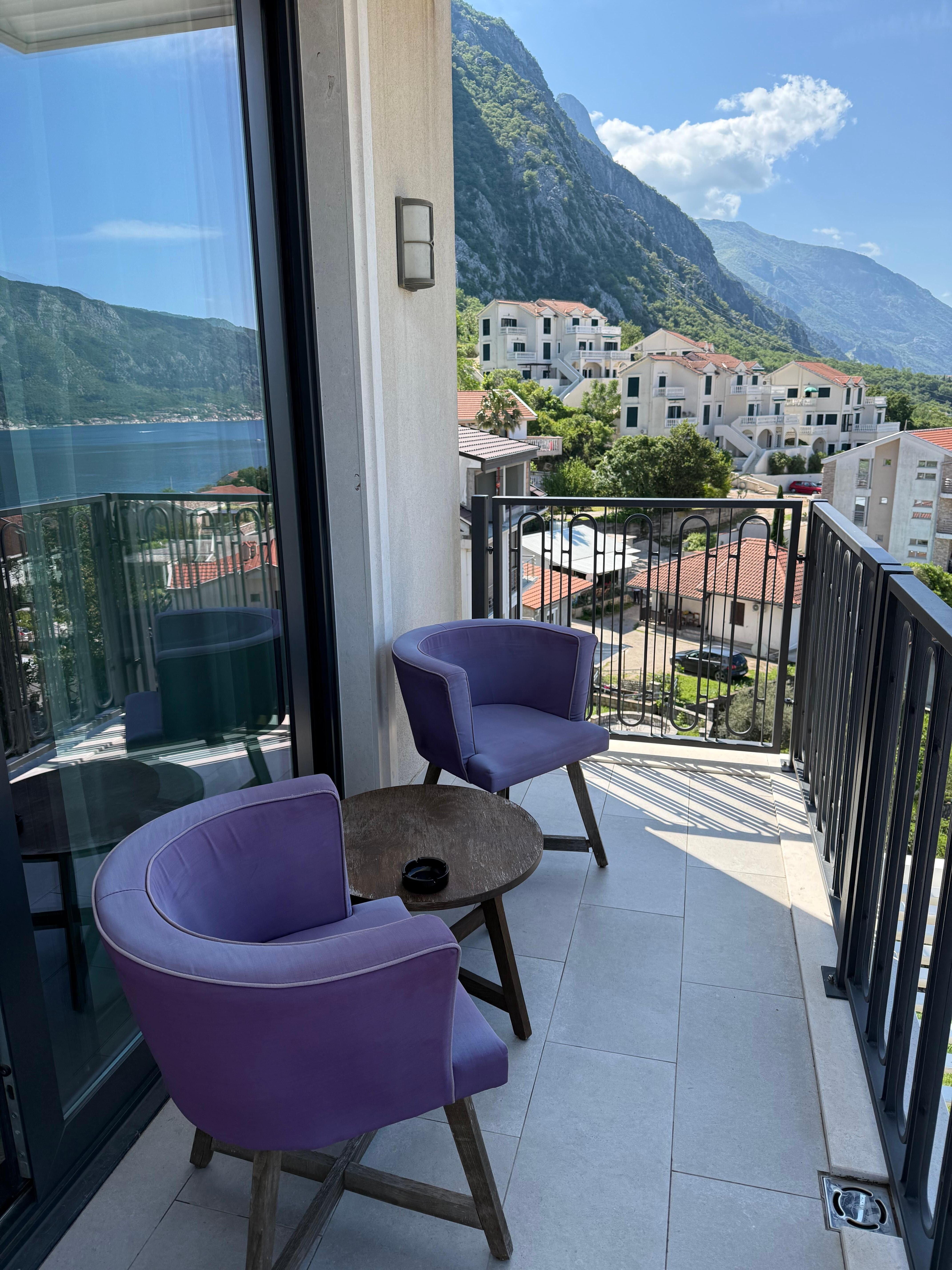 Balcony. Wish they had different chairs because these chairs stayed wet from rain. 