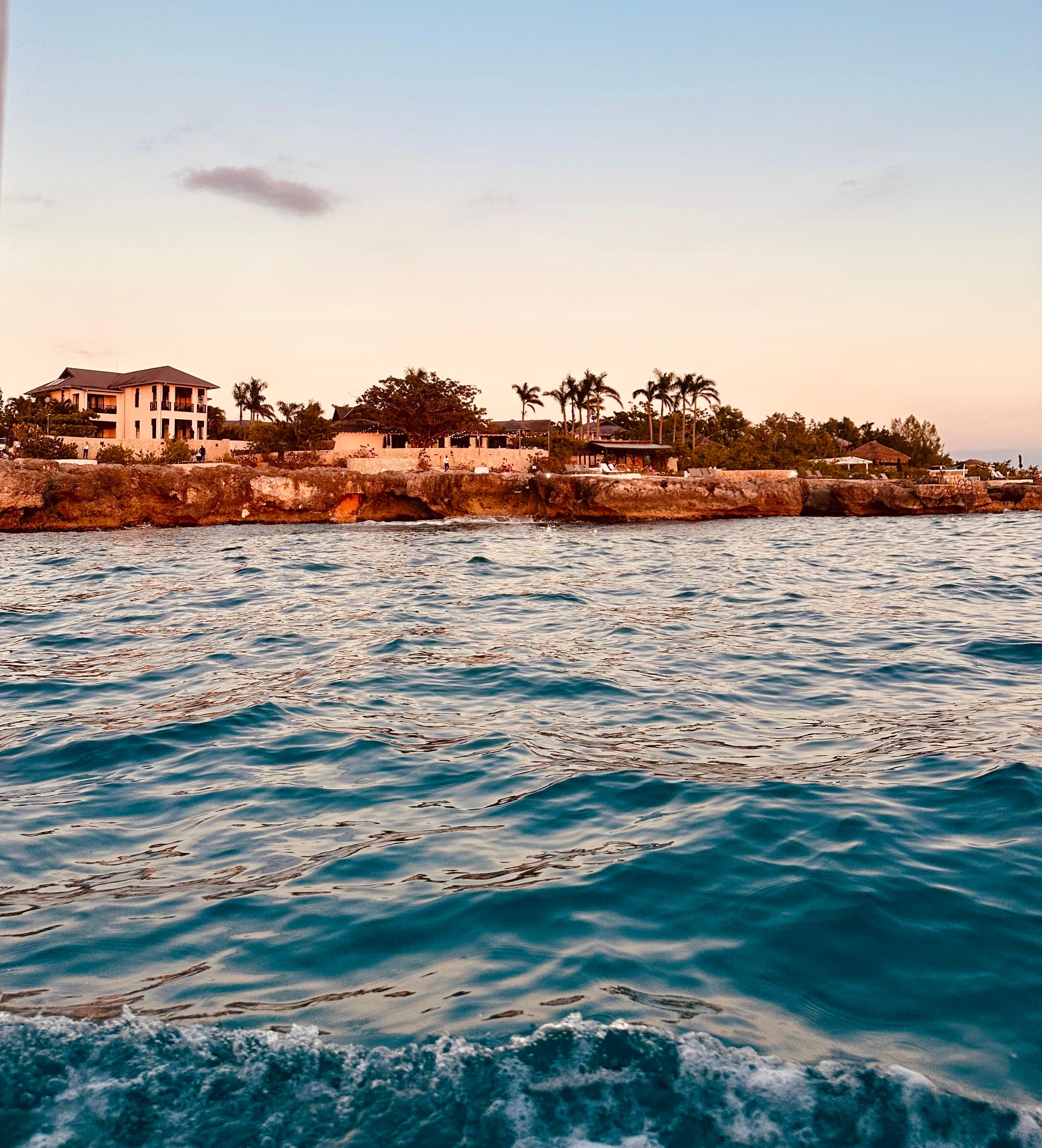 We took a boat ride one evening this is the Cliff Hotel a view from the sea. Most of the hotel is a little back from the sea but you can see the Restaurant and chair set up! 