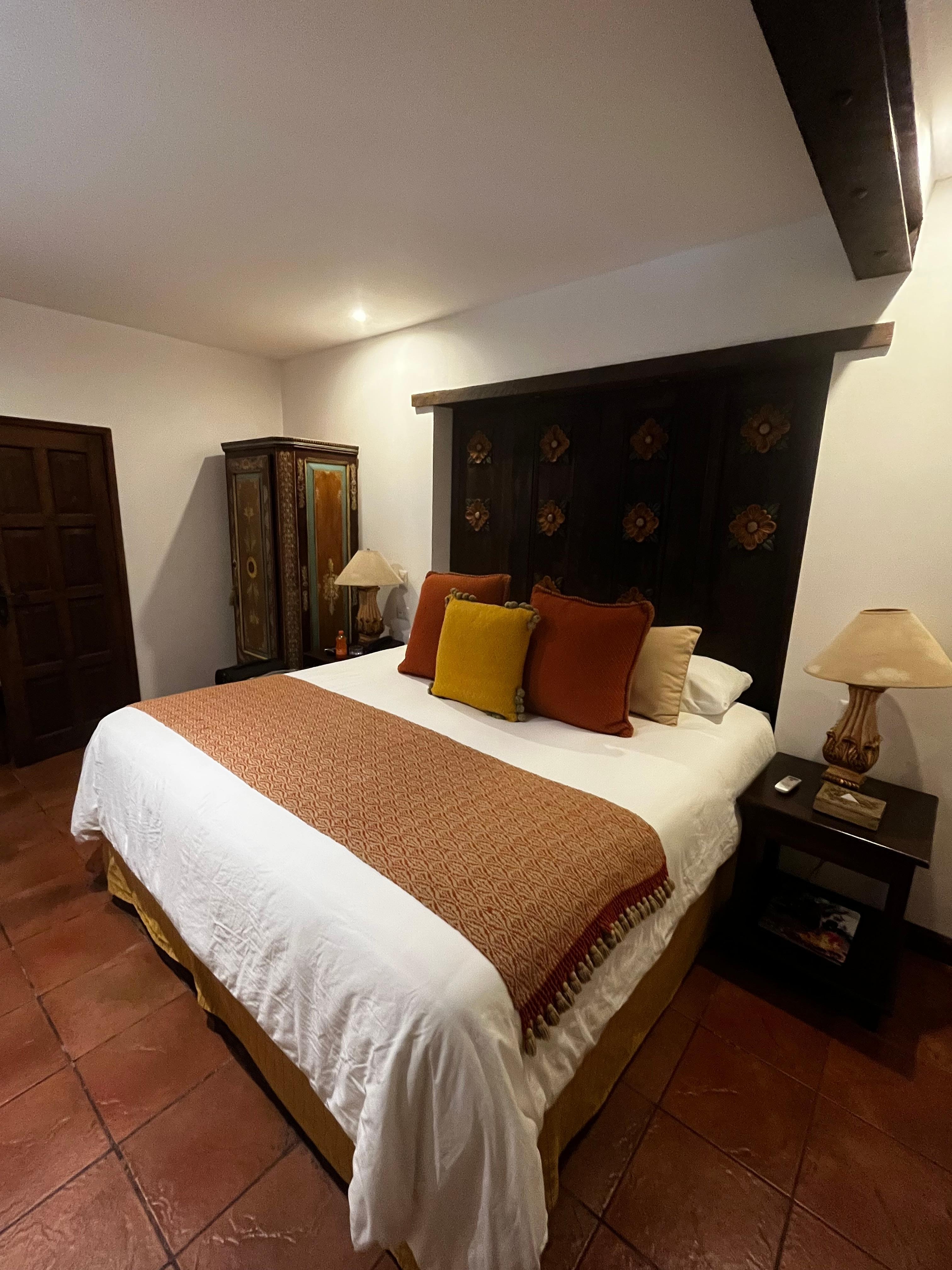 Deluxe room with a king bed - tile flooring and bathroom was clean.  