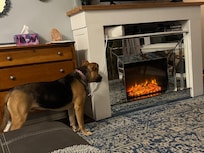 Living room with heat emitting electric fireplace