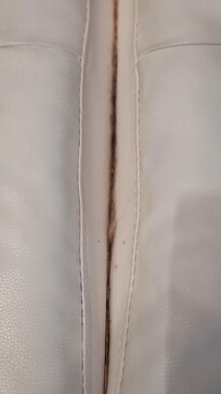 Between cushions on futon