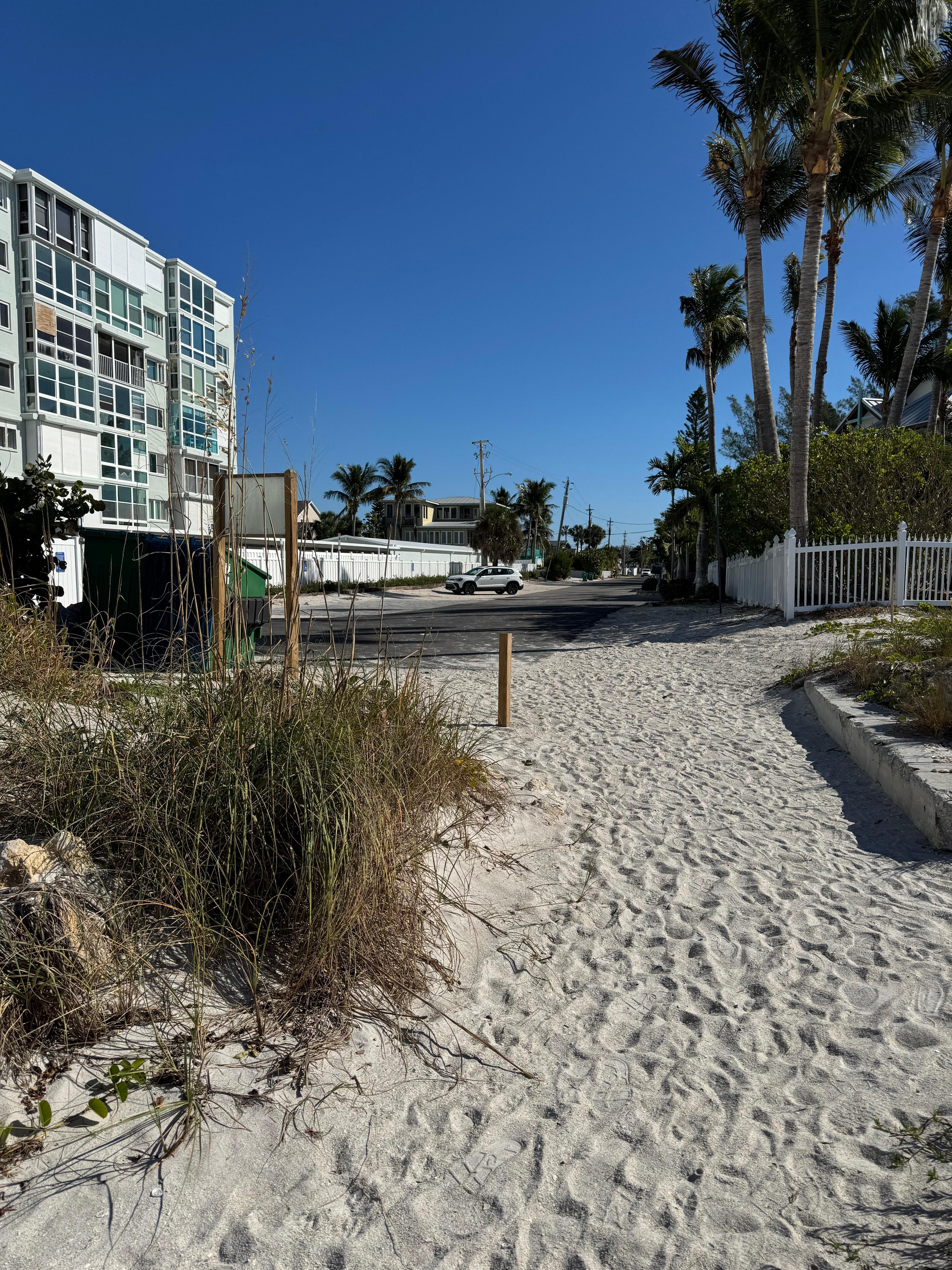 View looking back at the house from the entrance of the beach.