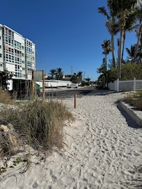 View looking back at the house from the entrance of the beach.