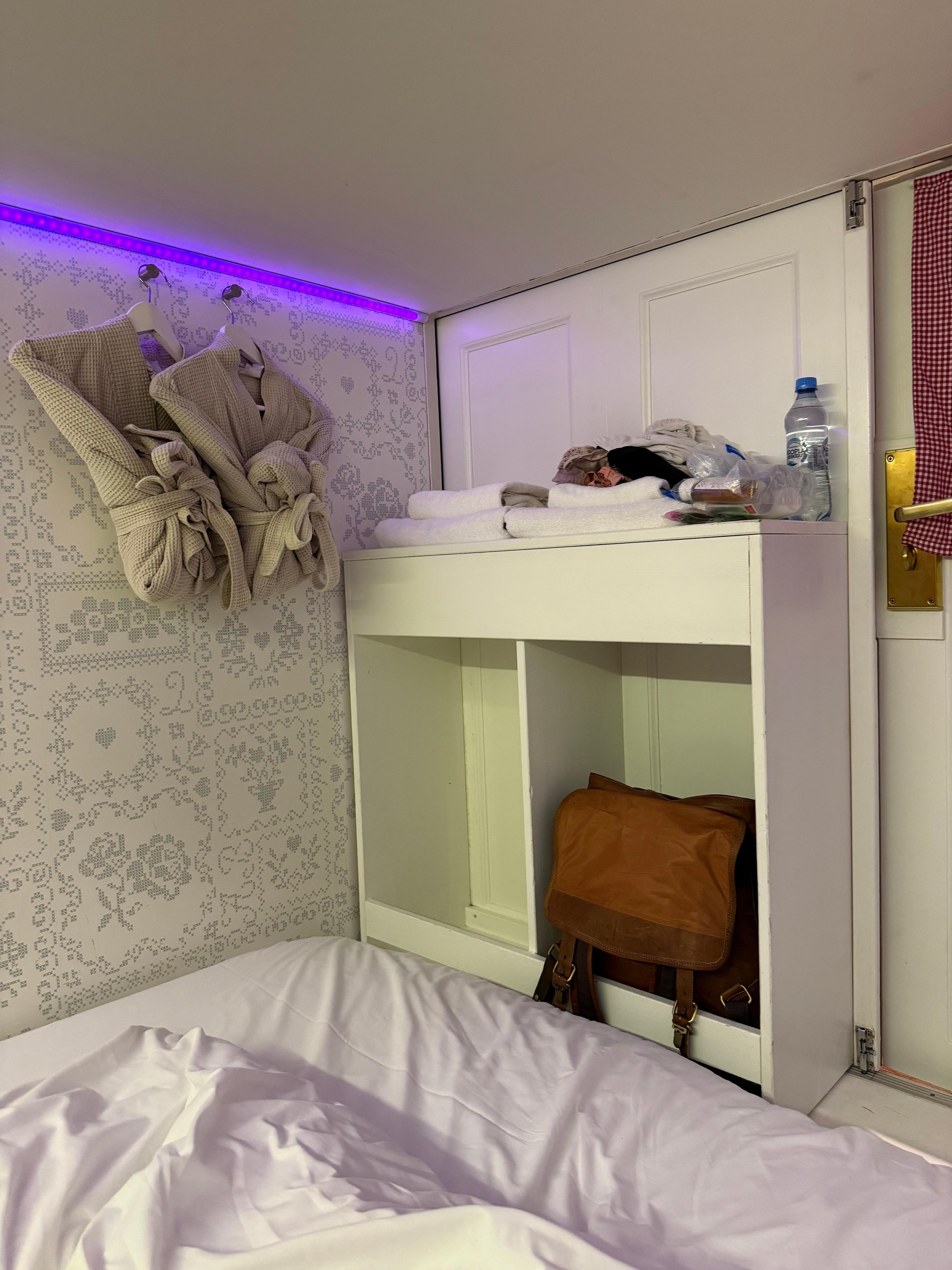 Place for storage with towels and robes. 