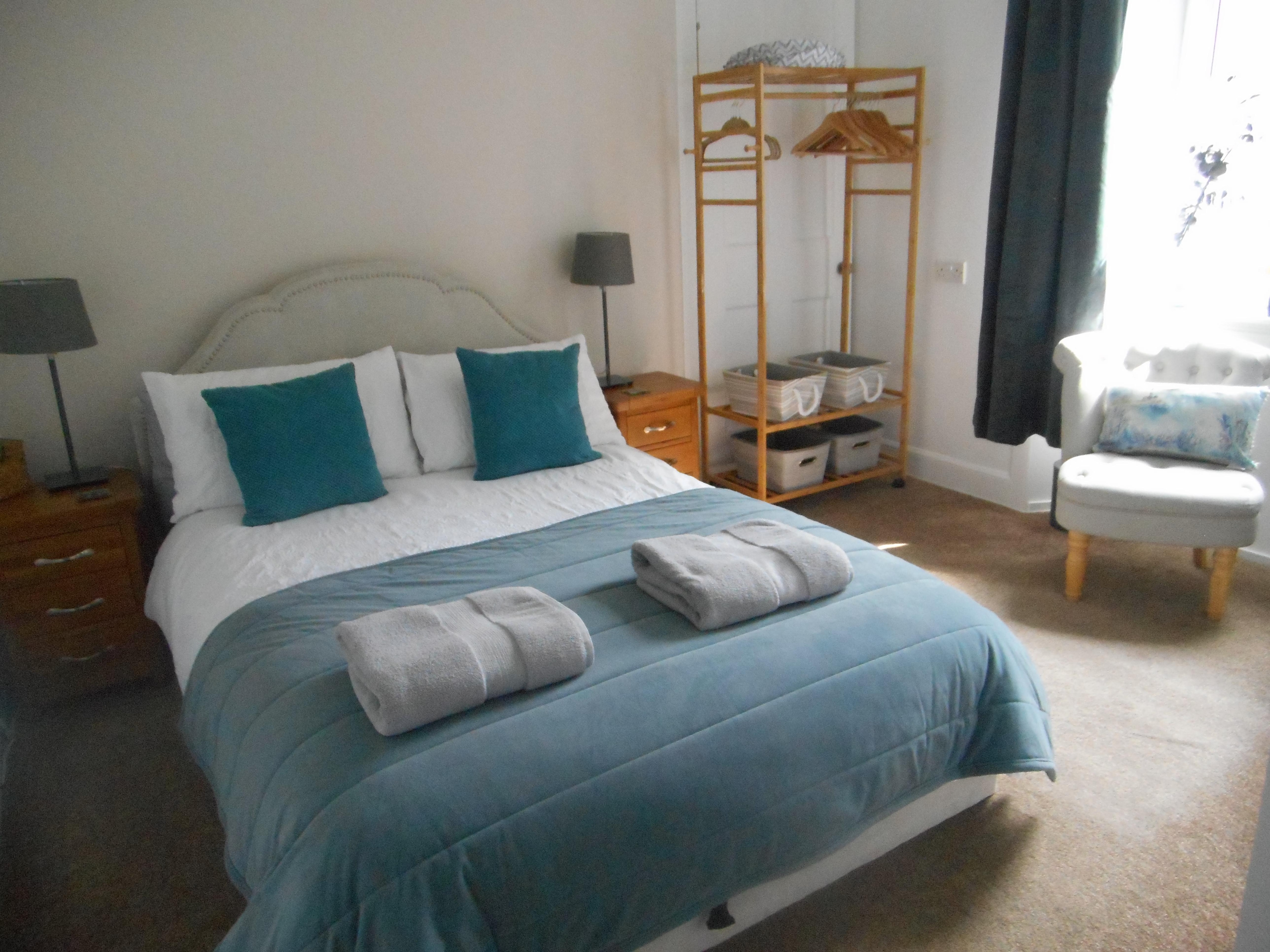 Bedroom was warm and bright with storage. Facing rear gardens with blackout curtains. 