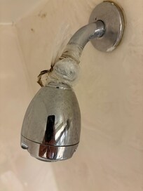 Shower head water leak with plastic bag