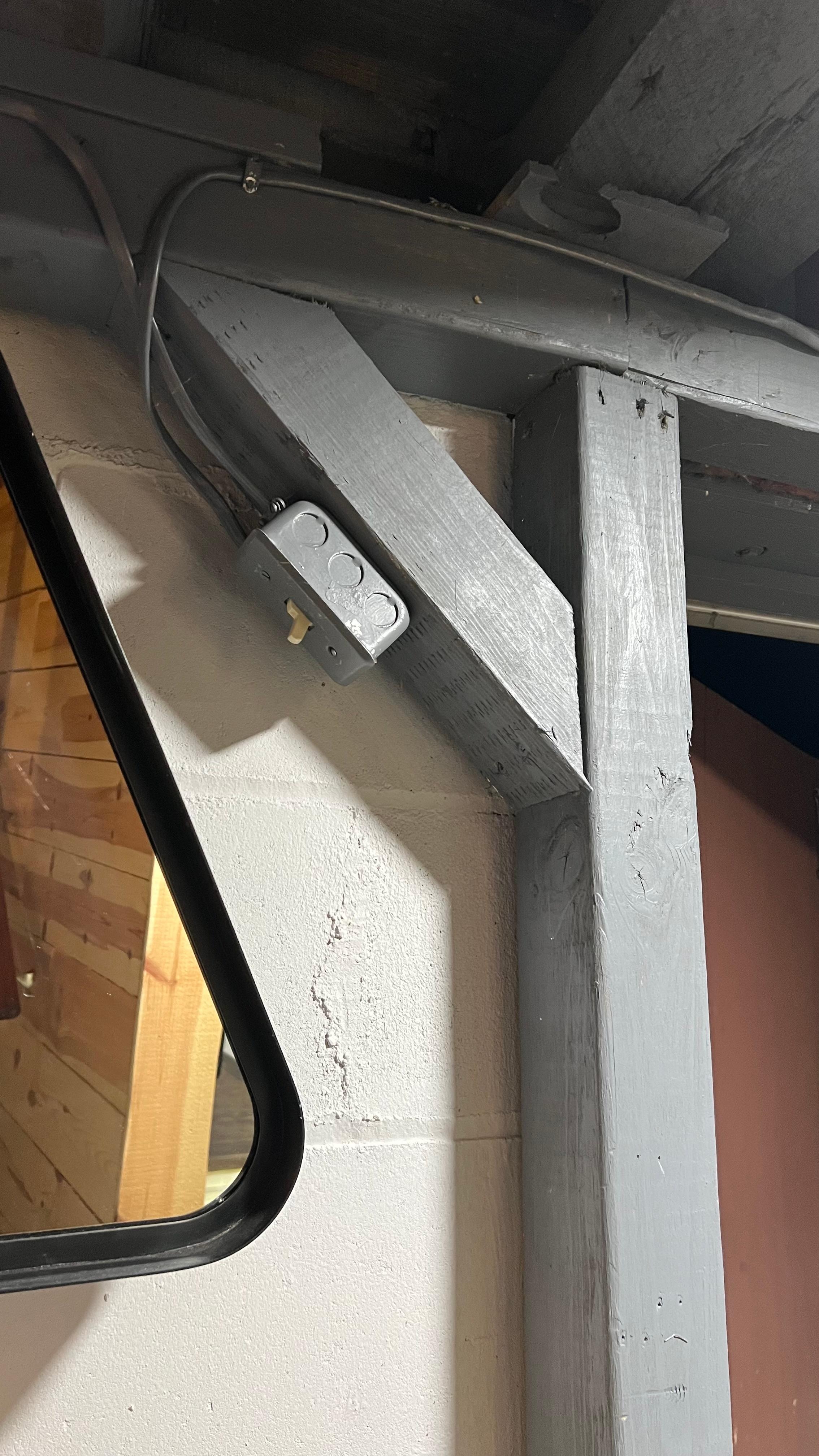 It took a bit of searching in the dark to find the basement level light switch tucked up to the right of the lower entrance.
