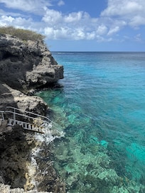 Stairs at resort to access water and immediately snorkel/dive.