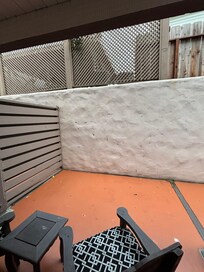 Patio left uncleaned, facing trash bins