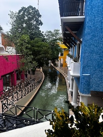 River that runs through lobby to stores and theater