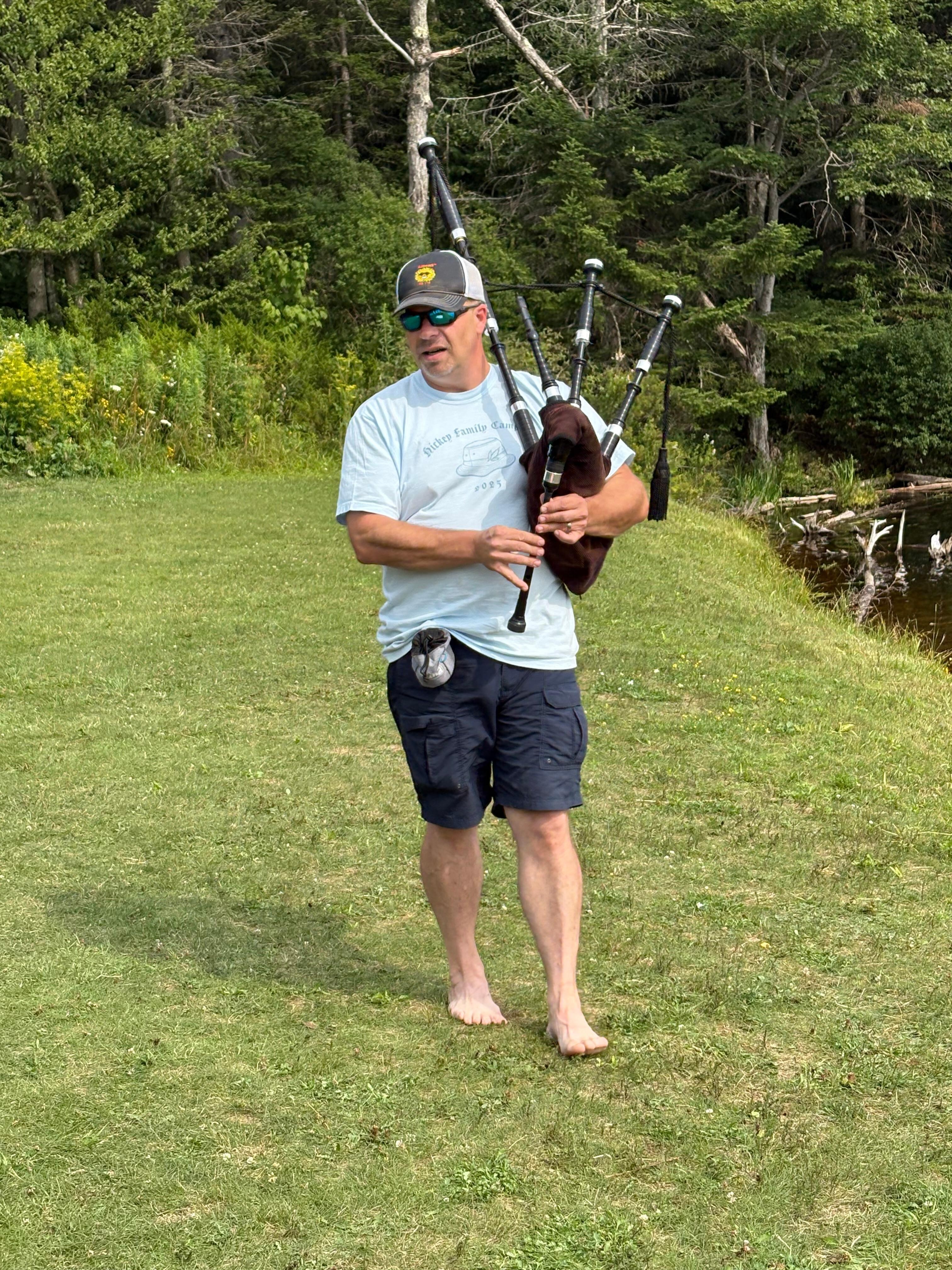 Our nephew playing bagpipes at the lake & getting huge applause!!