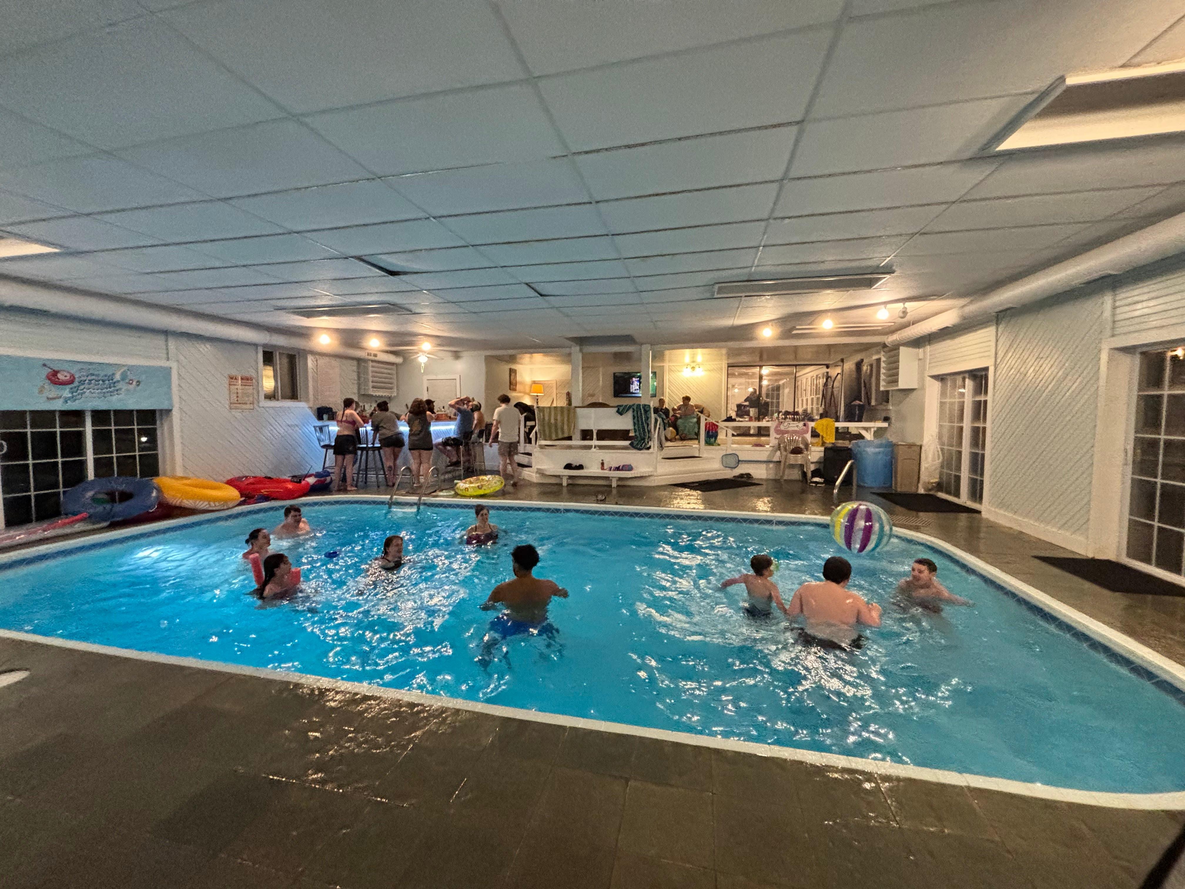 Family volleyball in the pool