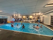 Family volleyball in the pool
