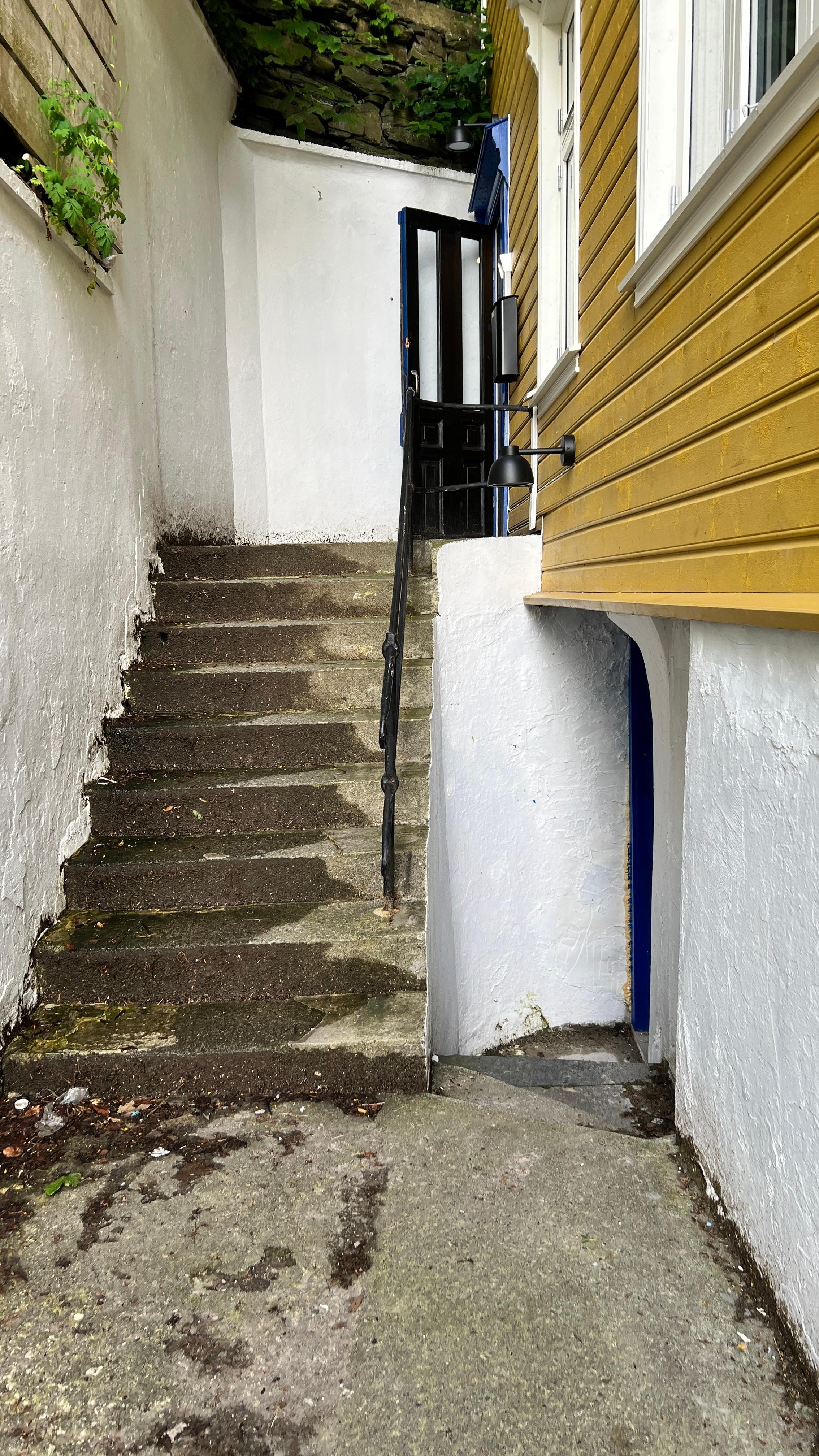 The entrance of the building, hard to locate and poor quality and dirty
