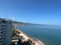 Daytime beach and city view