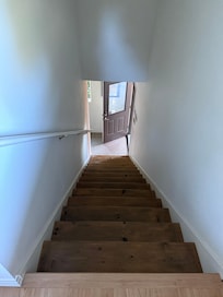 Stranger access door is at the bottom of the stairs to the left.