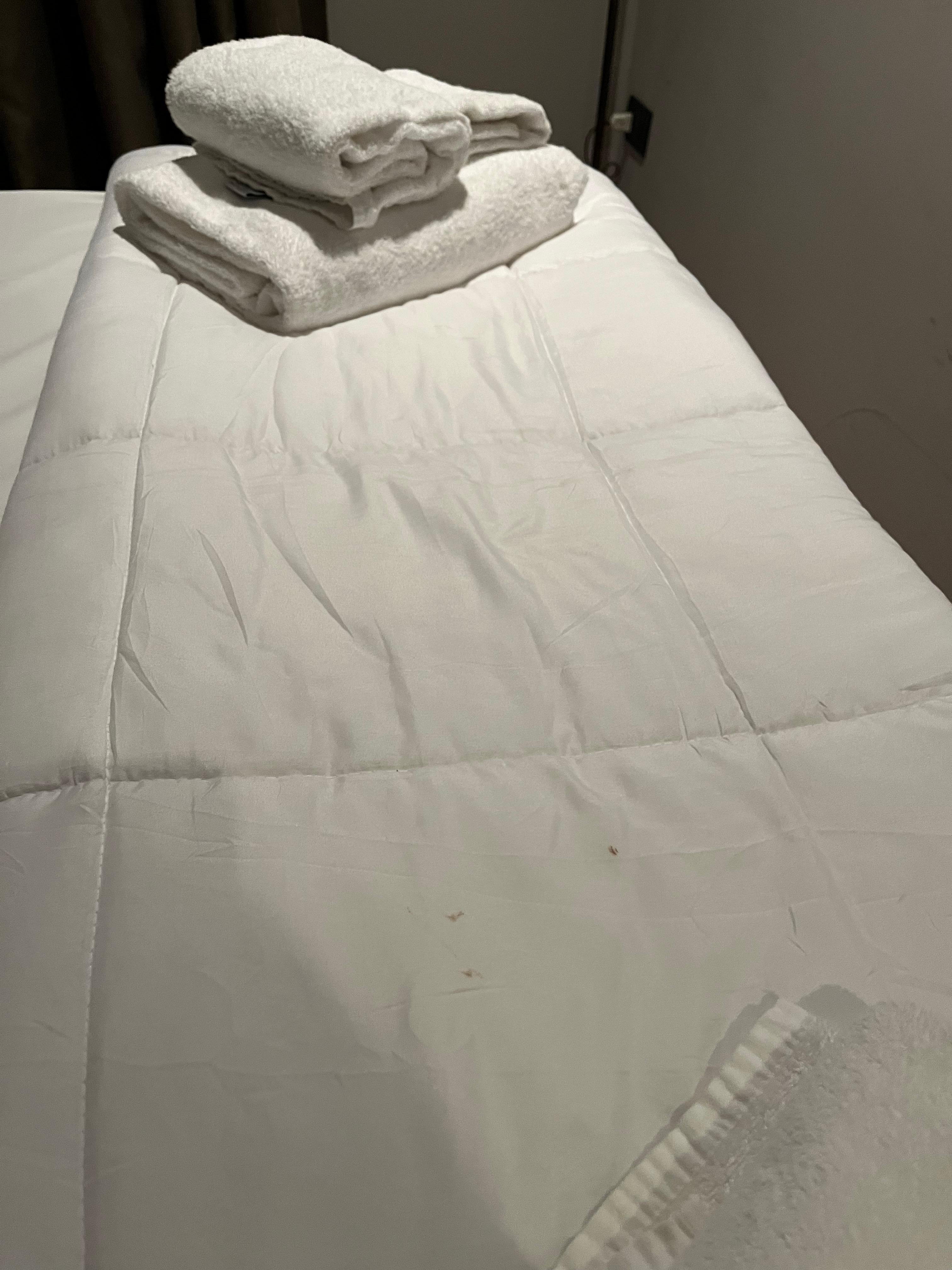 Dirty bedding textiles (and no duvet cover, not available at the facility)