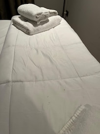 Dirty bedding textiles (and no duvet cover, not available at the facility)