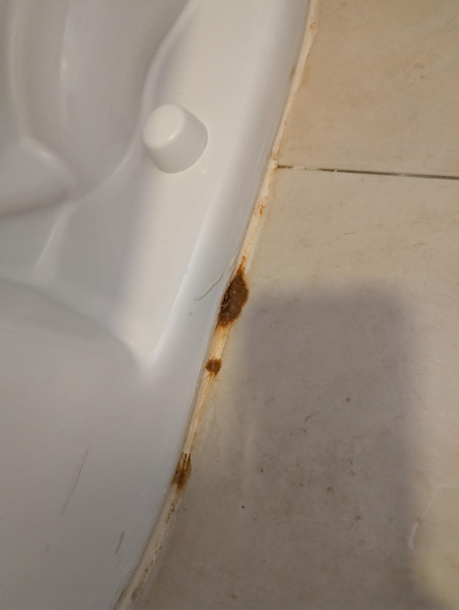 It's on top of the caulking and is NOT oxidization.