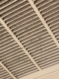 Ceiling vent outside the bedroom door.