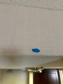Gum on ceiling near door.