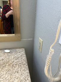 Scraped paint and dirty sink and mirror