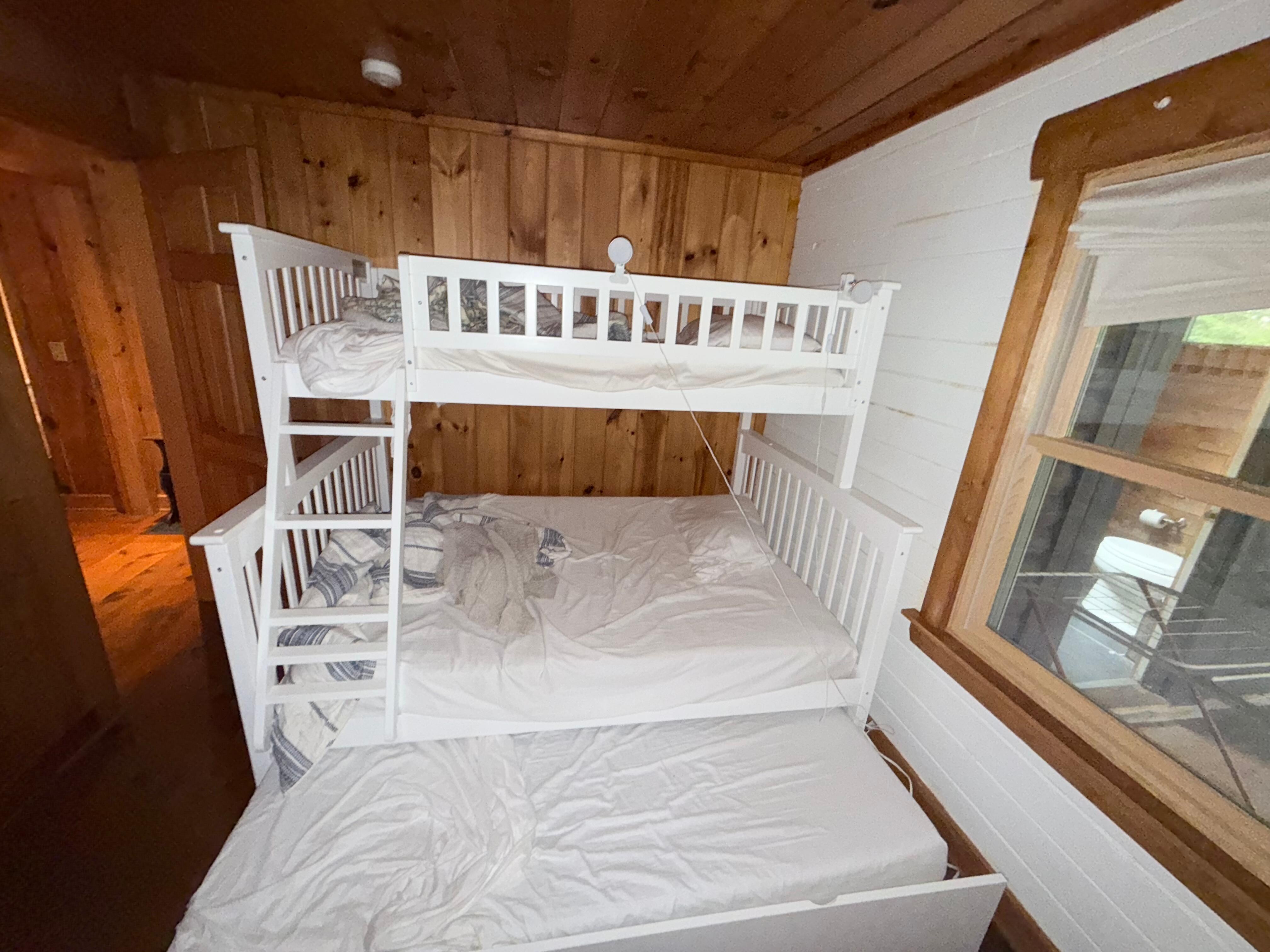 Kids' bedroom sleeps 4: one on top, two on the lower bunk and one in the pull-out trundle bed