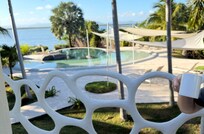 Coffee at the balcony overlooking the pool lagoon and further