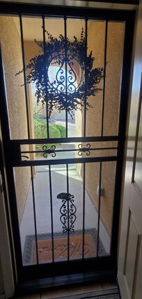 Front entrance with locking front security screen.