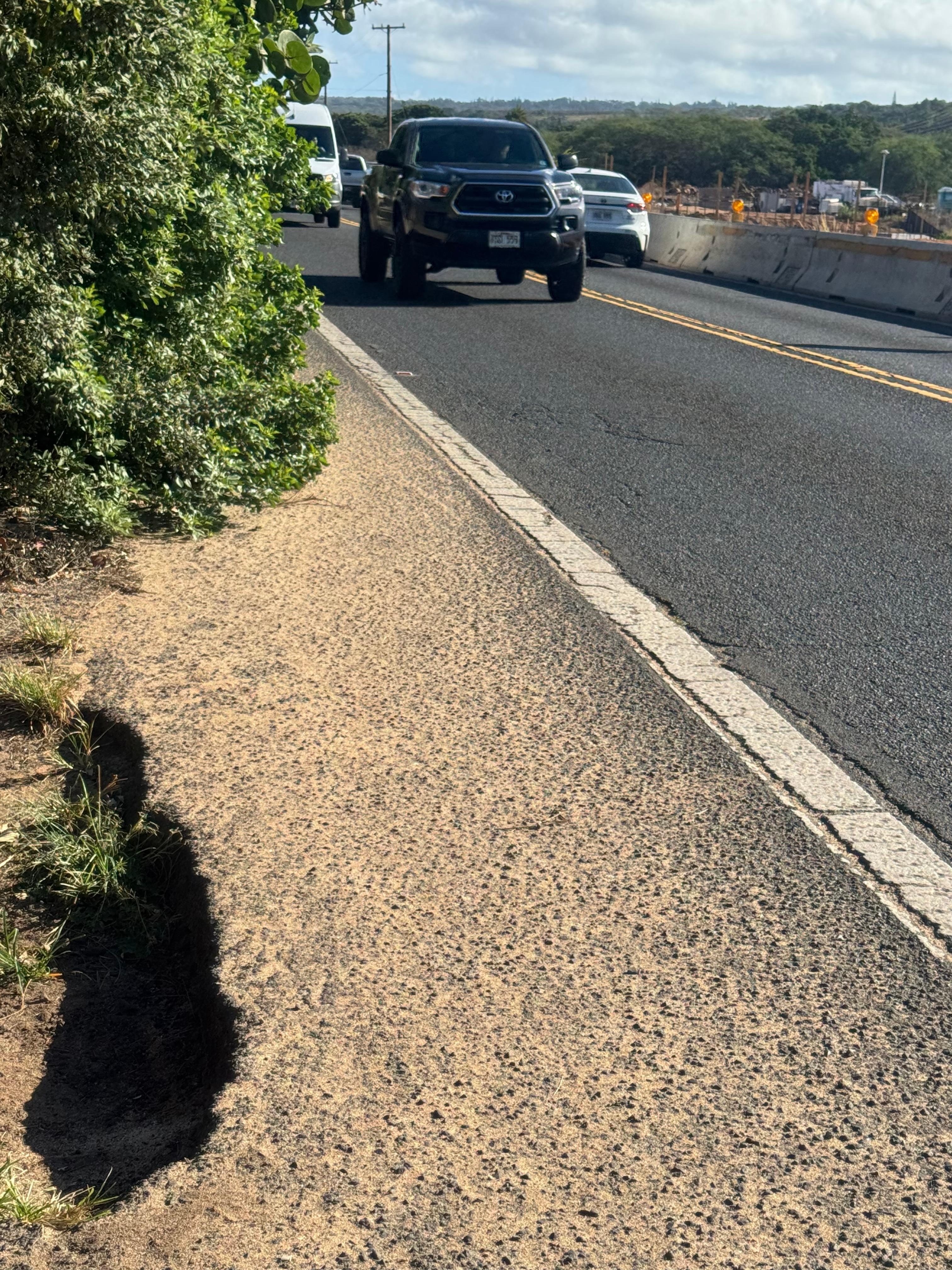 Walk to beach. Trees blocking way and usually there is a car parked there. Have to walk in Traffic to pass. 