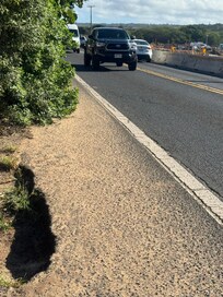 Walk to beach. Trees blocking way and usually there is a car parked there. Have to walk in Traffic to pass.