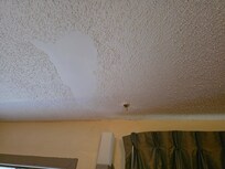 Ceiling above the window.