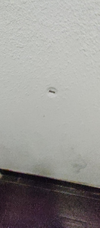 Hole in the wall from other tenants. Was there before we arrived.