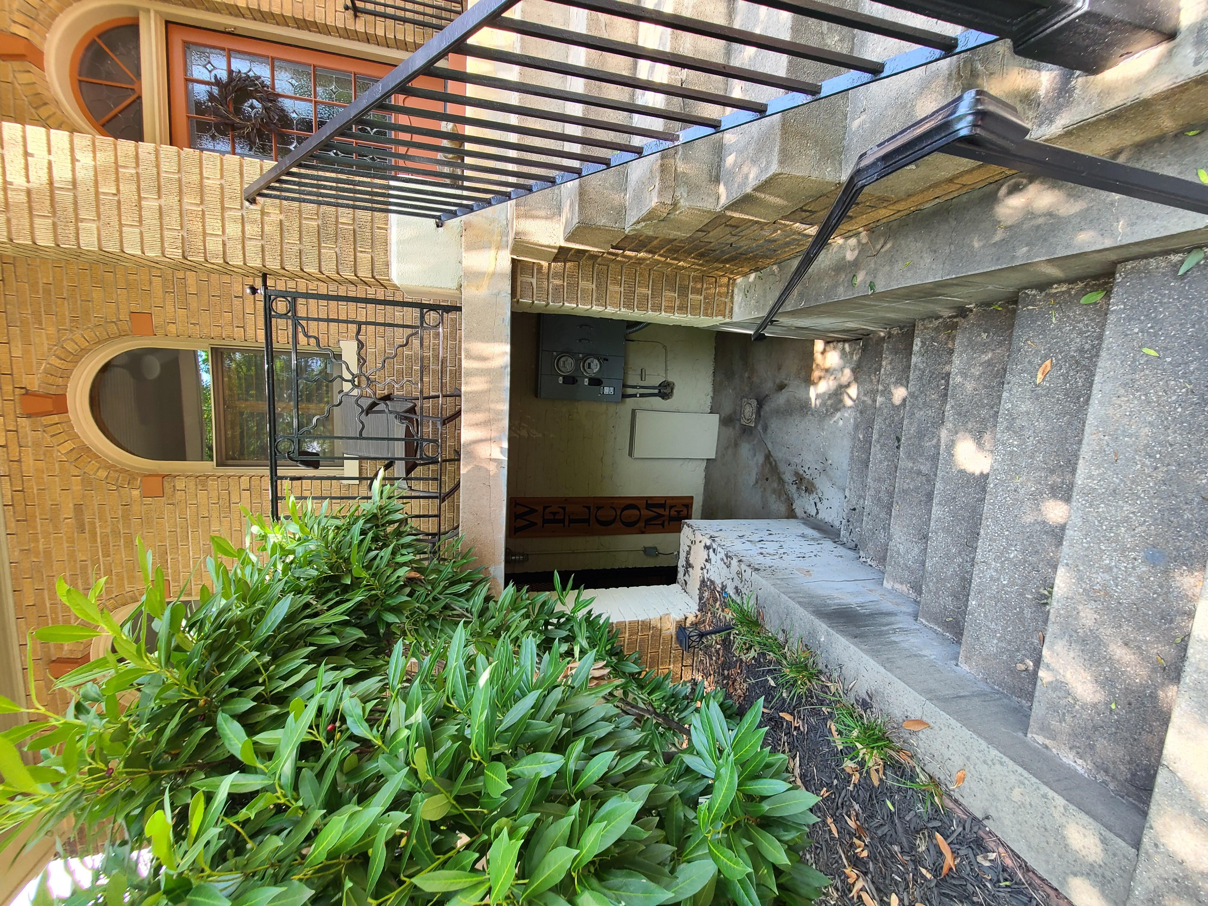 The front of the home, stairs going down to the rental.