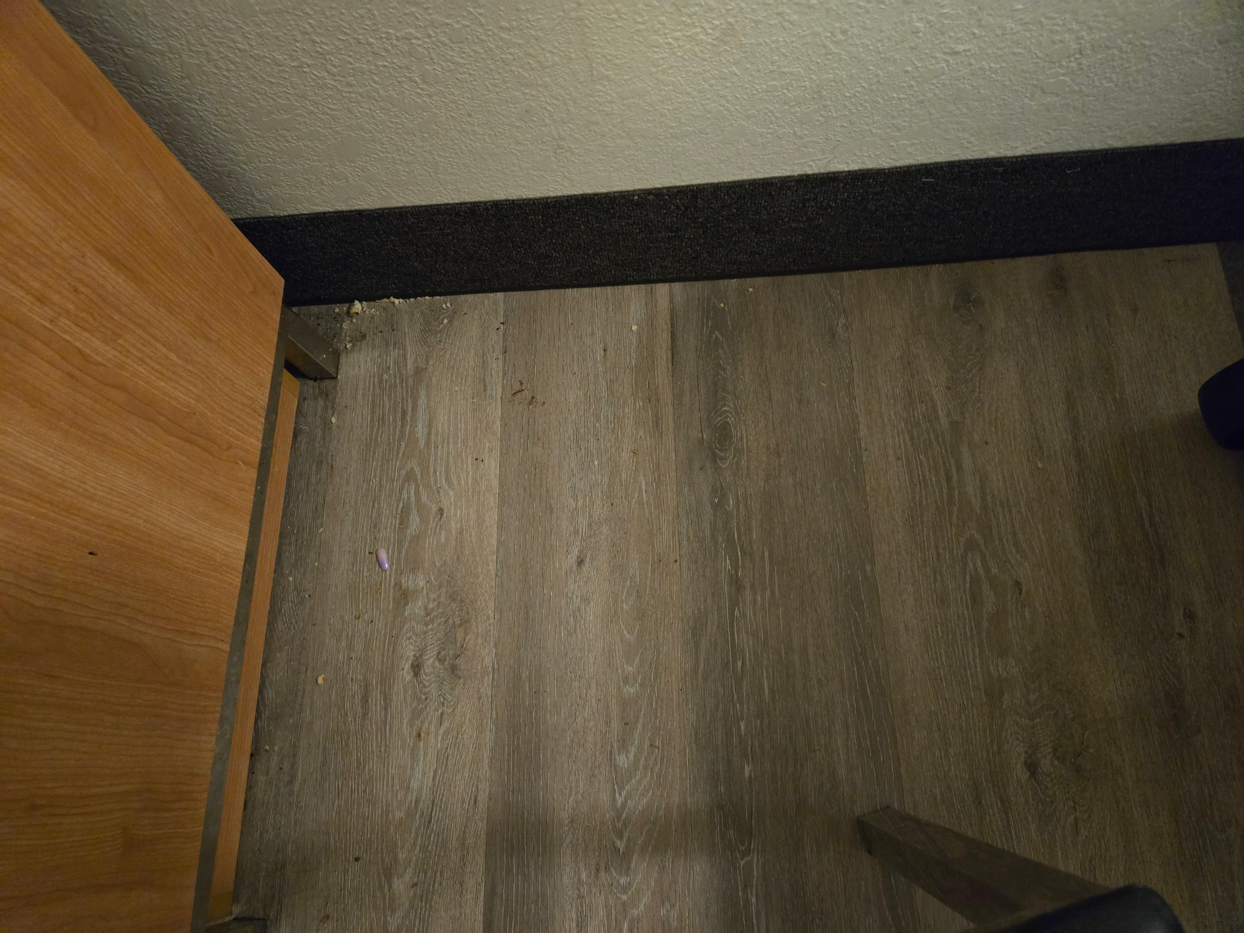 Fake nail and dirt in corner 