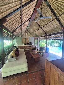 Lounge room open giving amazing feeling of being in a rainforest setting.