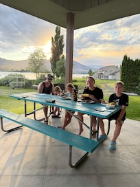 One of two big picnic/outdoor seating.  Lots of chairs and propane grill too.