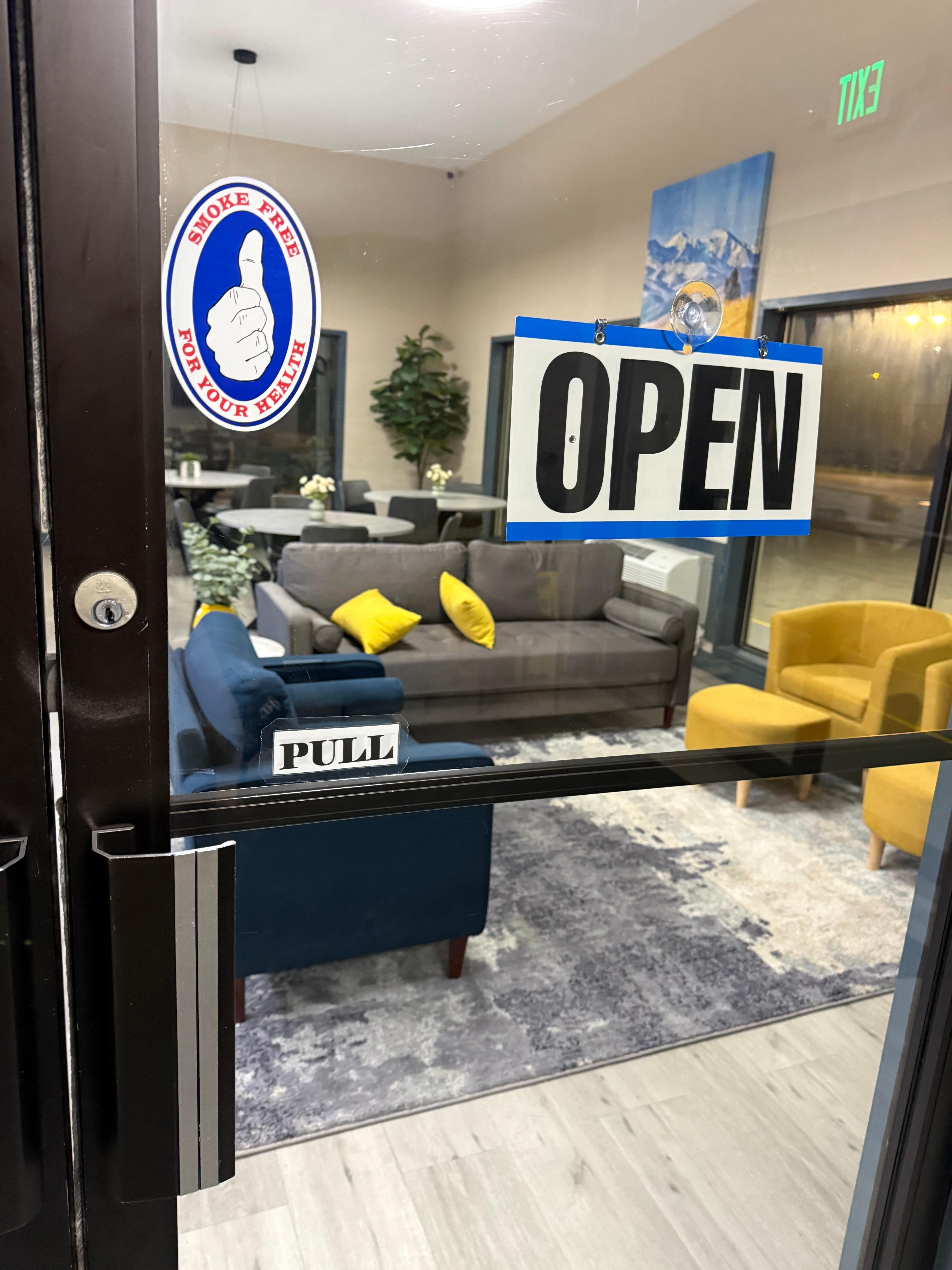 The sign says “Open” but door locked. 