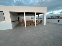 Rooftop. They put out cushions during the day. Very comfy