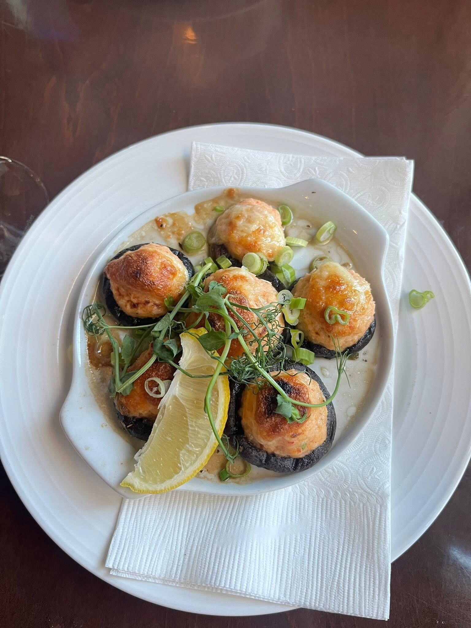 Appetizer at hotel restaurant cram stuffed mushrooms 