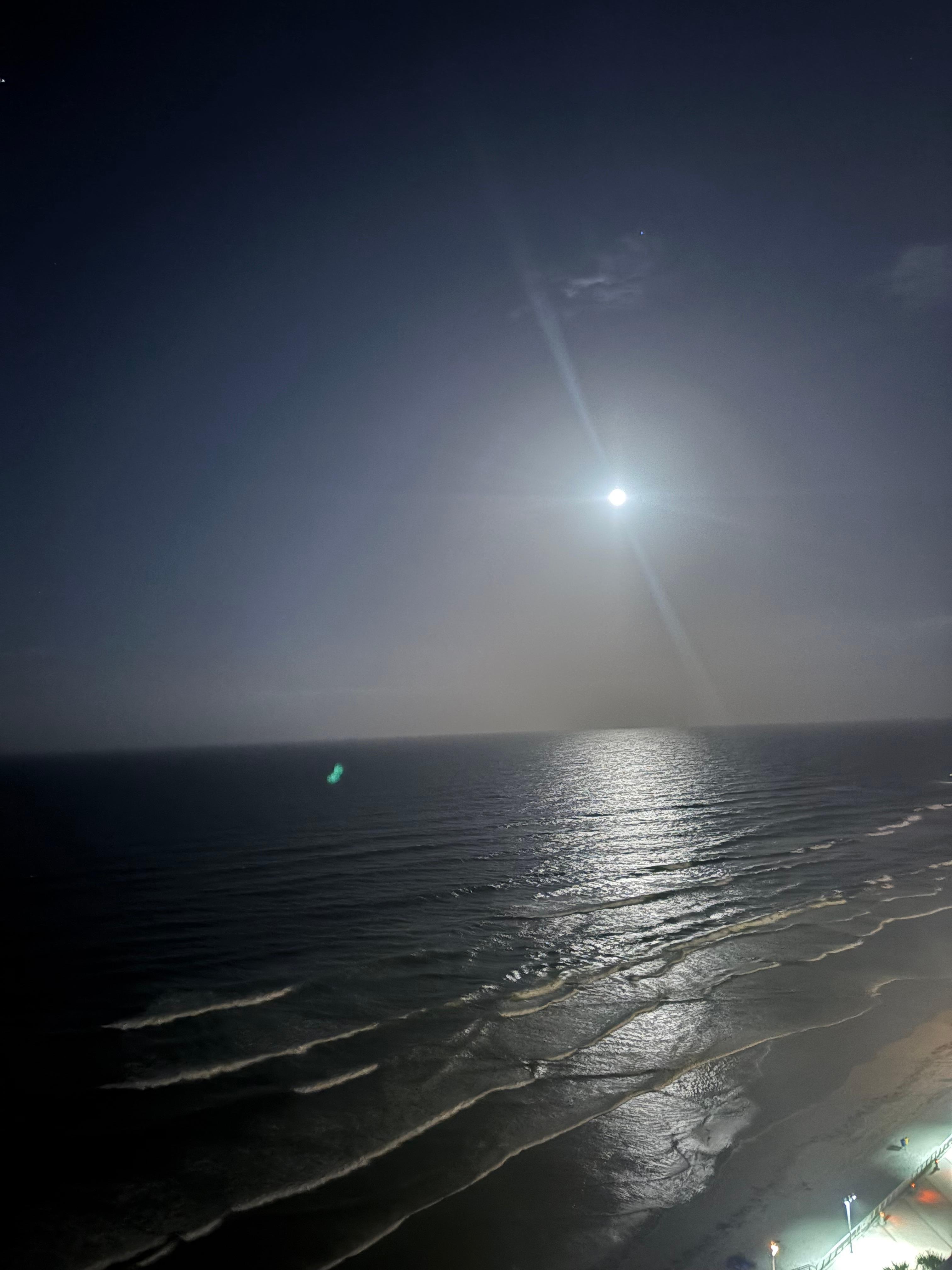 The moon lit up the ocean at night
