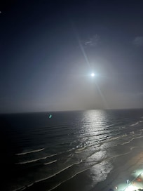 The moon lit up the ocean at night