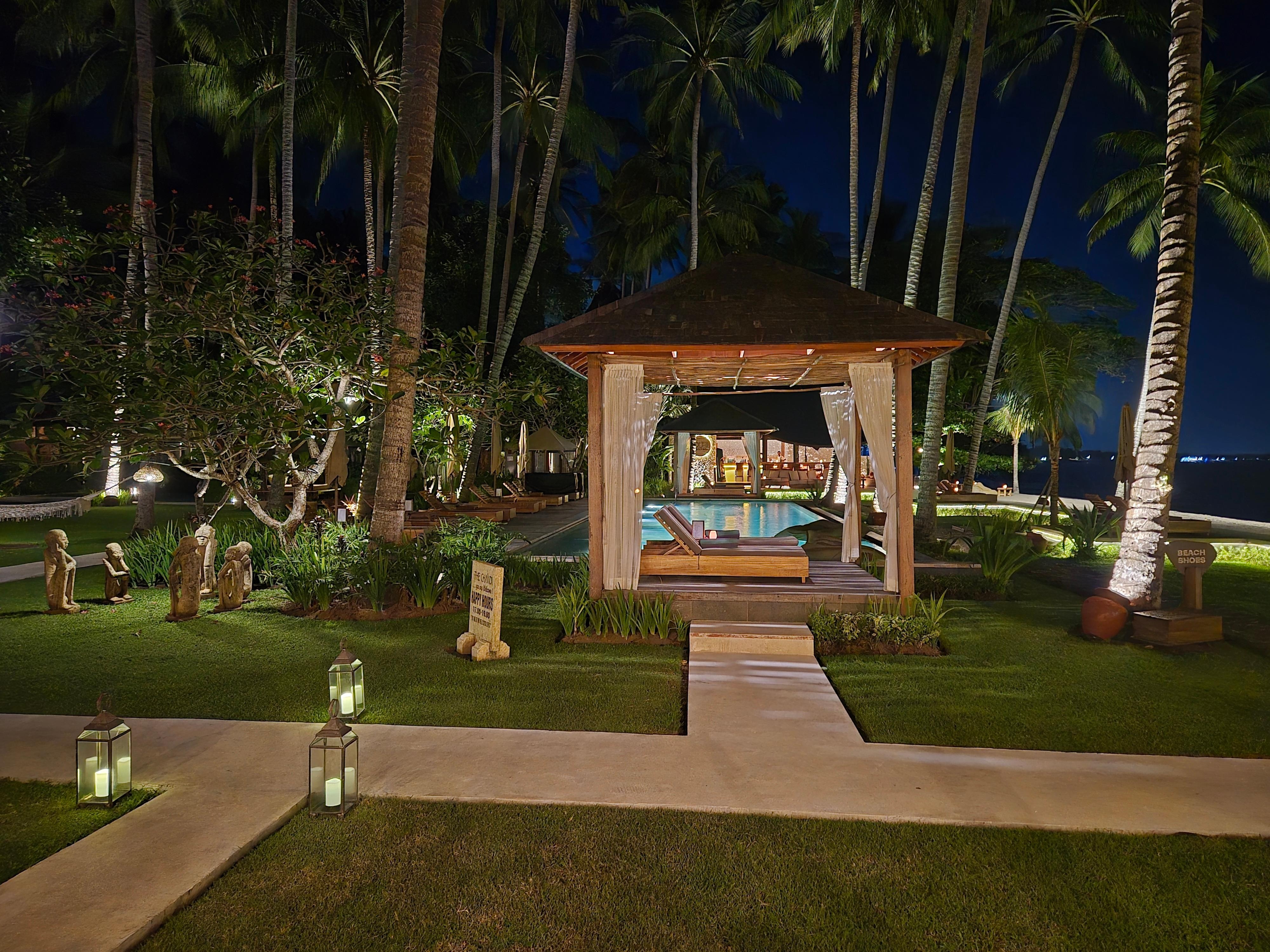 Garden and pool area at night