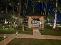 Garden and pool area at night