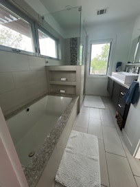 Beautiful hand- crafted glass fixture above stairs