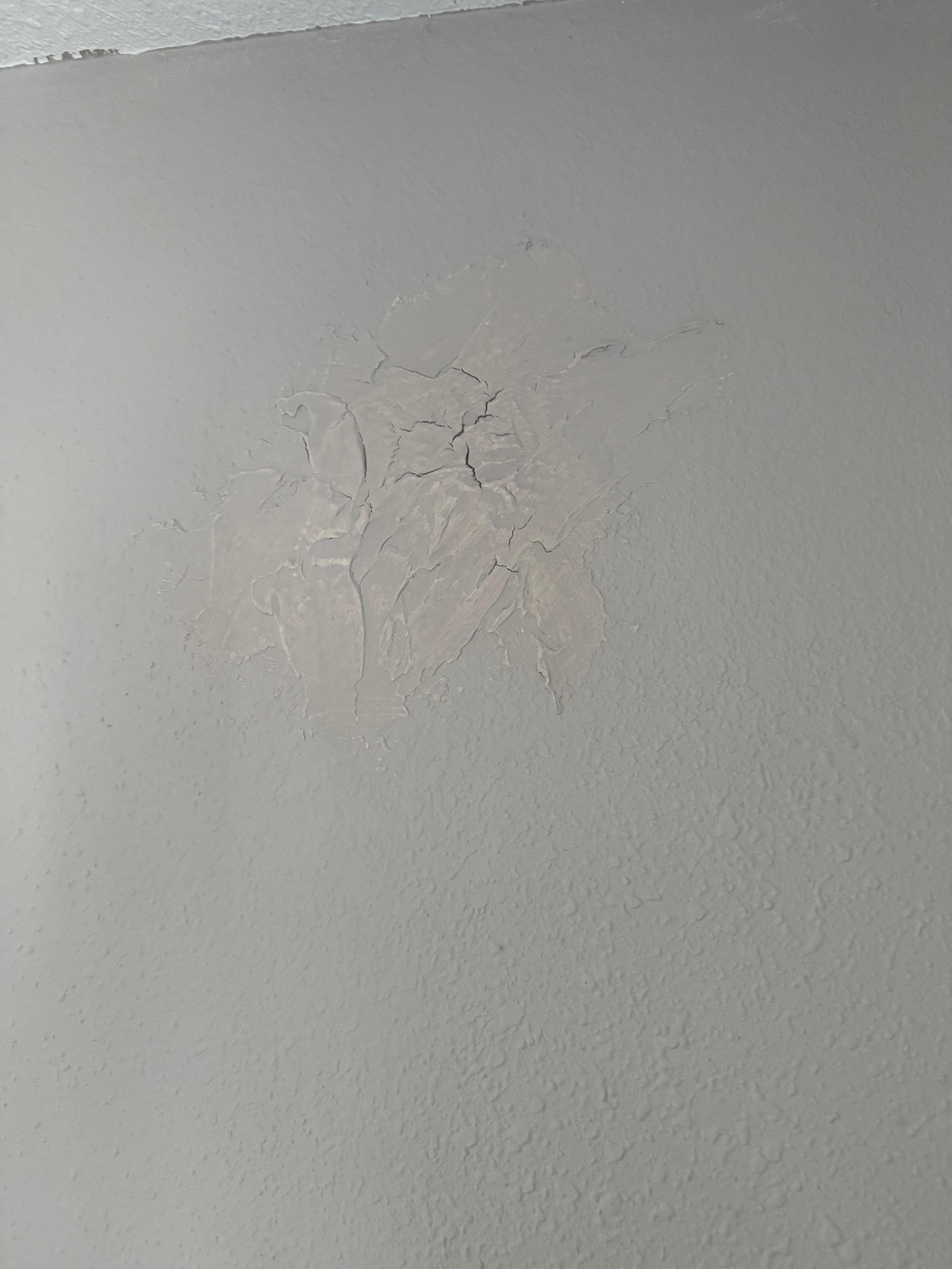 Poorly patched holes in the wall
