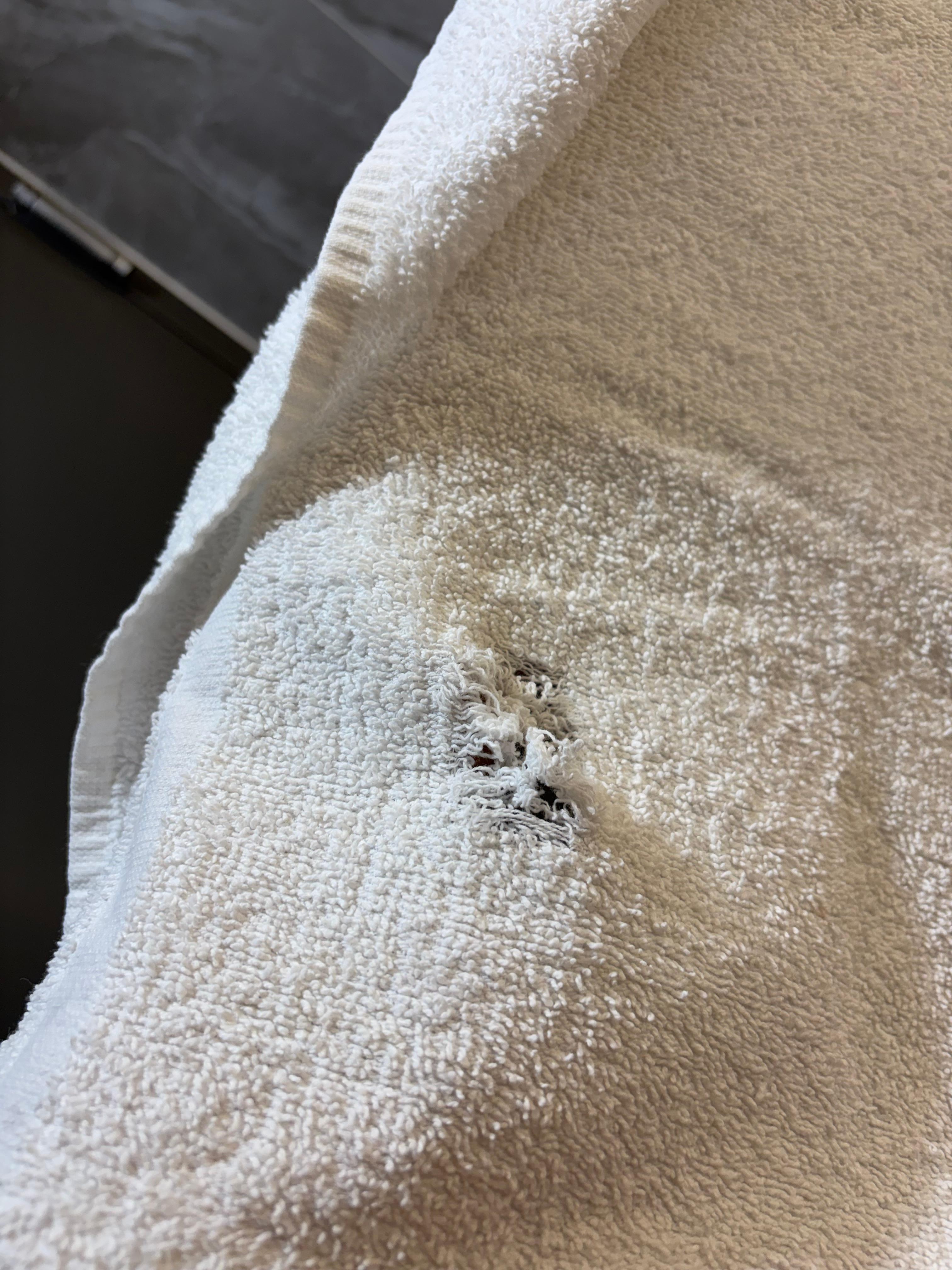 Shower towel with hole.