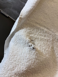 Shower towel with hole.