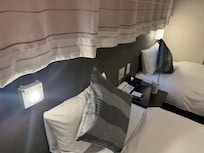 The overhead lamp cover was missing and could be dangerous (upon touching the hot light bulb directly).